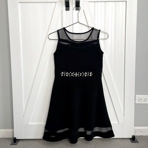 Black party dress with jewels.